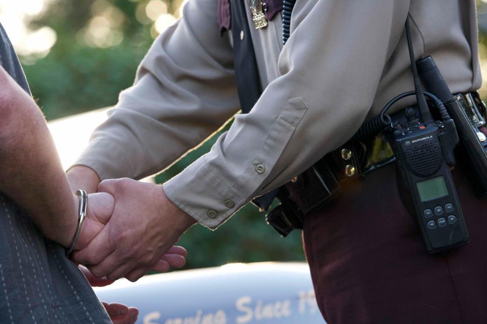 Photo of a Minnesota State Trooper making an arrest