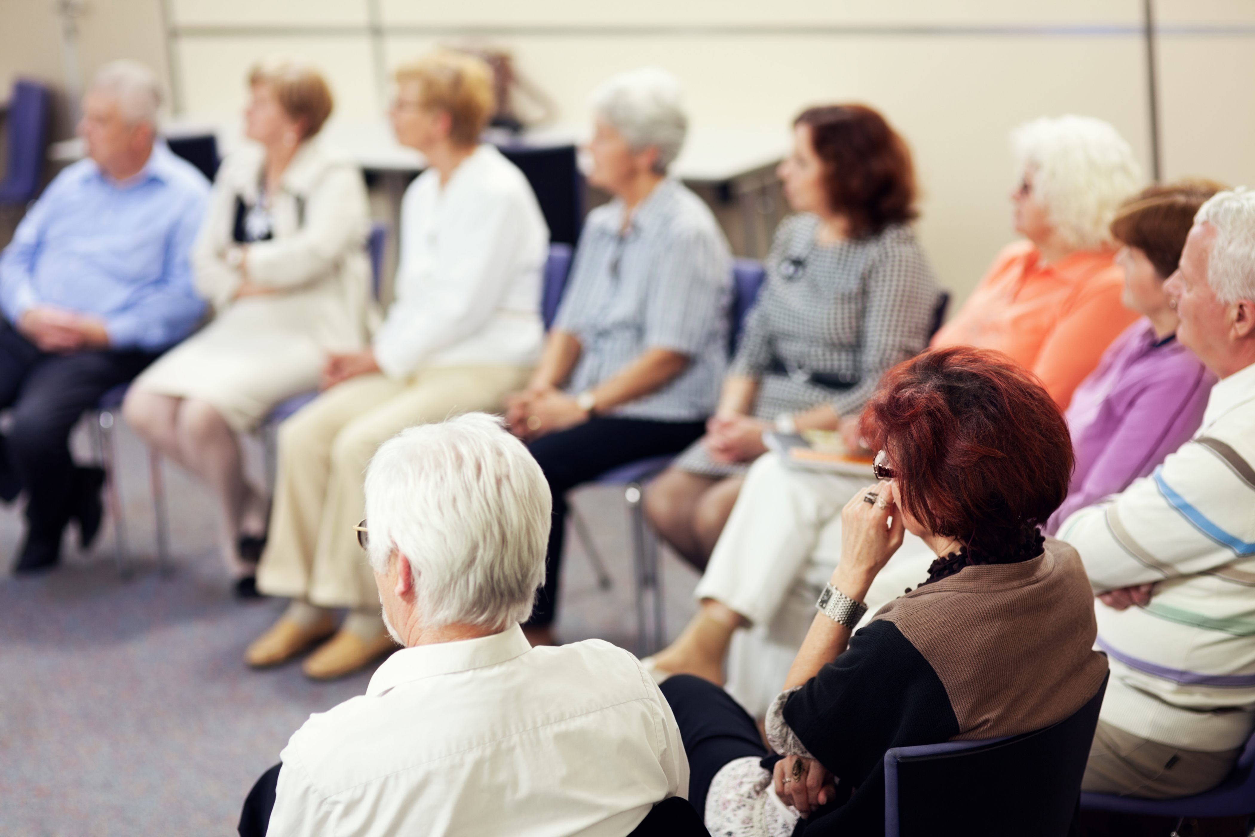 Group of older adults sitting in circle. Group of older adults sitting in circle.