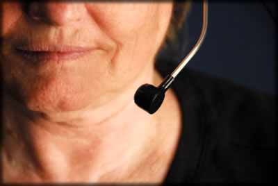 A woman with a headset on