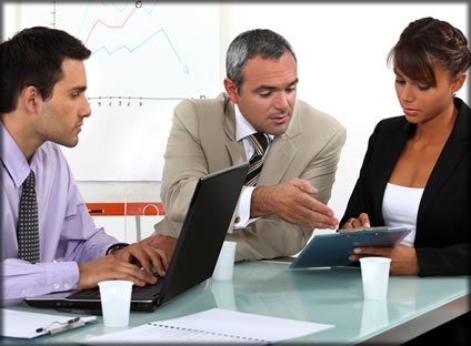 Two men and a woman having a meeting.