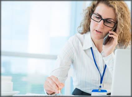 A woman on a cell phone.