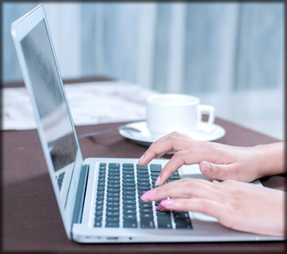 a person typing on a laptop