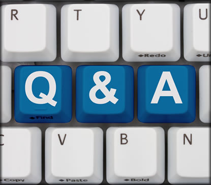 Close up of computer keyboard with three  keys that say q, &, and a.