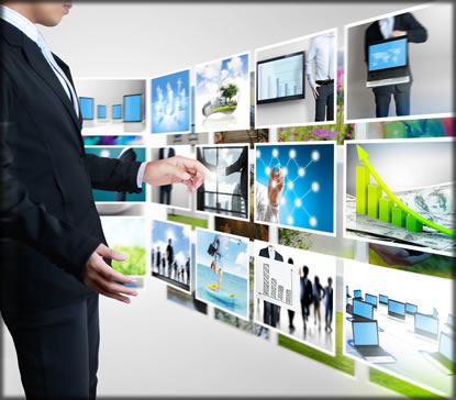 A man standing next to several pictures of technology.