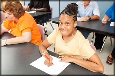 Person with a disability in a classroom. 