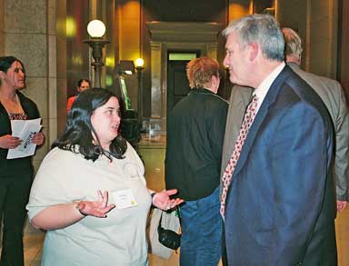 Class member talks with legislator