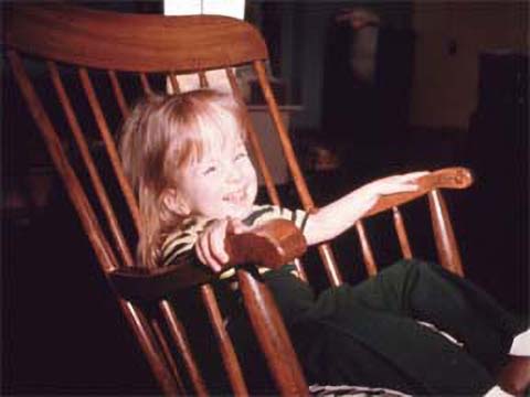 Happy child in rocking chair