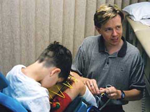 Child receiving assistance from father